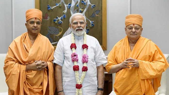 Prime Minister Modi with Ishwarcharan Swami and Brahmavihari Swami of the influential Bochasanwasi Akshar Purushottam Swaminarayan Sanstha | Photo: Twitter/@narendramodi