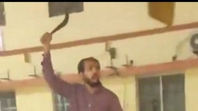 Screen grab of Ahmed Murtaza wielding a machete at Gorakhnath Math