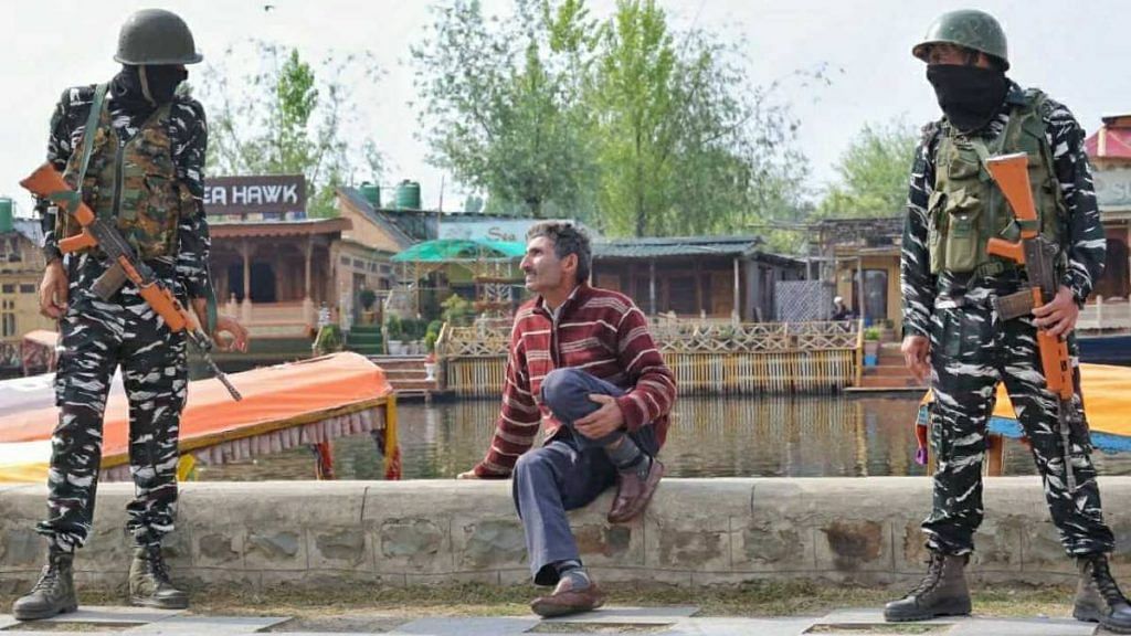 Security personnel with a local resident at Dal Lake in Srinagar | Photo: Praveen Jain | ThePrint
