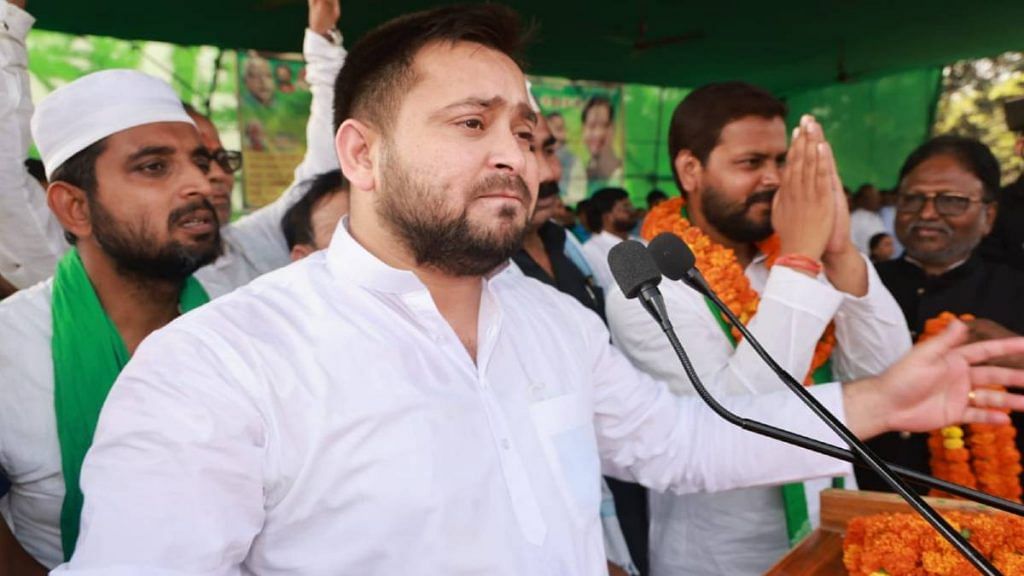 RJD leader Tejashwi Yadav with victorious candidate Amar Kumar Paswan during a campaign rally | ANI