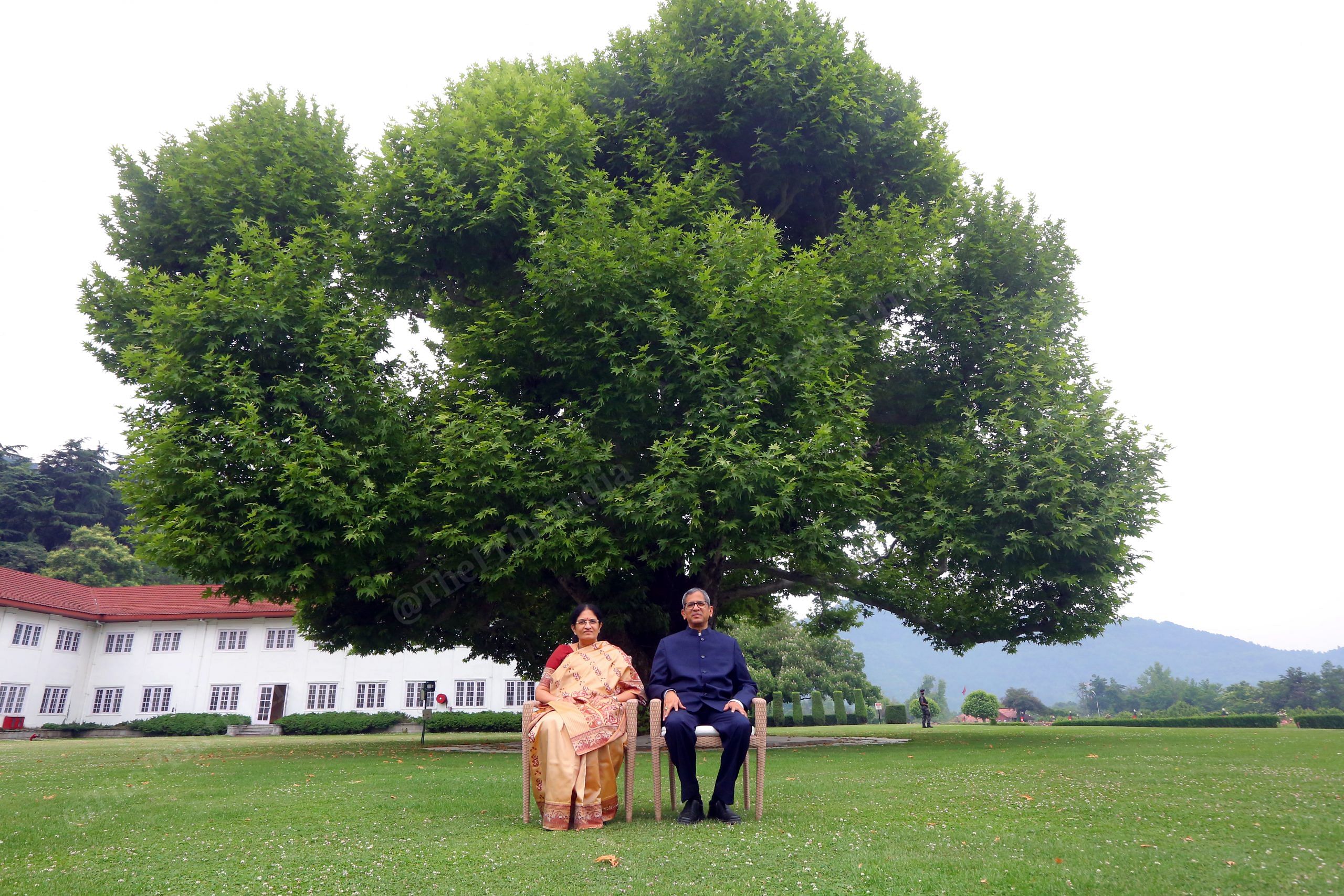 CJI N. V. Ramana and his wife Sivamala, sit under the chinar tree in Srinagar, under which Mahatma Gandhi had once sat with Maharaja Hari Singh in 1945 | Photo: Praveen Jain | ThePrint