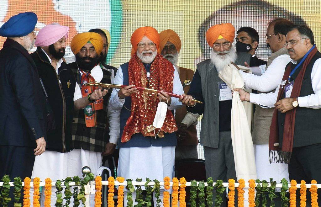  Prime Minister Narendra Modi with Punjab Lok Congress President Capt. Amarinder Singh during a public rally, ahead of Punjab Assembly elections, in Jalandhar on 15 Feb 2022.