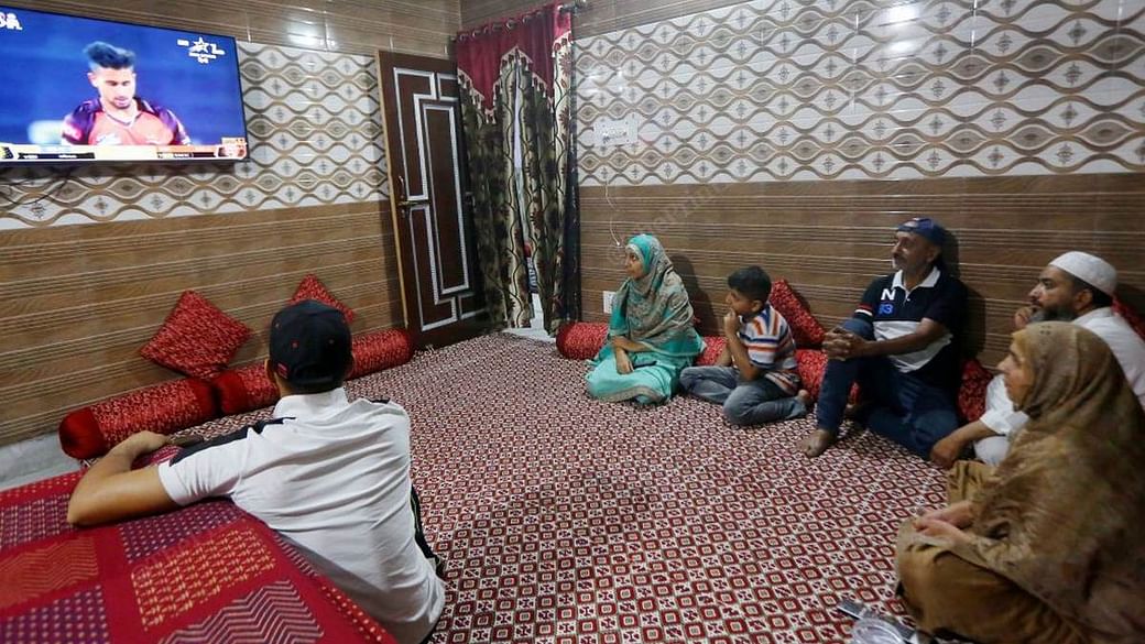 Umran Malik's family and friends watch him play for SunRisers Hyderabad in the Indian Premier League at their family home in Jammu | Photo: Praveen Jain | ThePrint