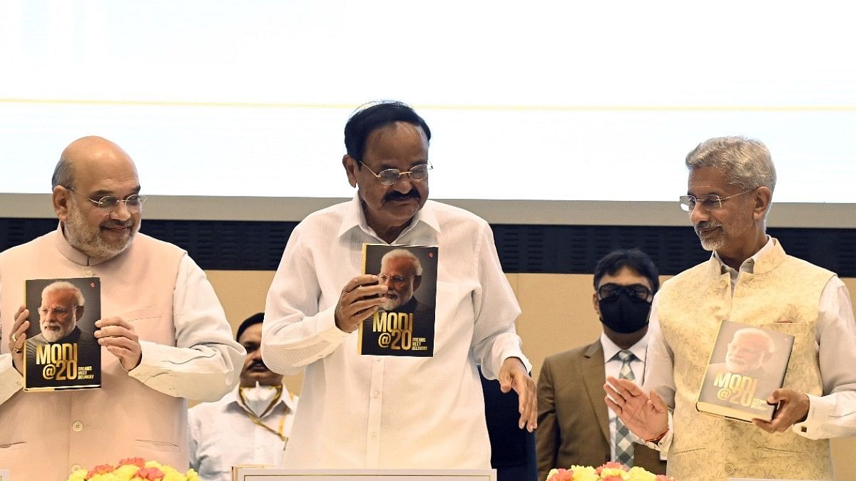 Book Minister of Home Affairs Amit Shah, Vice President of India Venkaiah Naidu, and Minister of External Affairs S. Jaishankar at the launch of a book titled 'Modi@20: Dreams Meet Delivery' at Vigyan Bhawan in New Delhi | Photo: ANI
