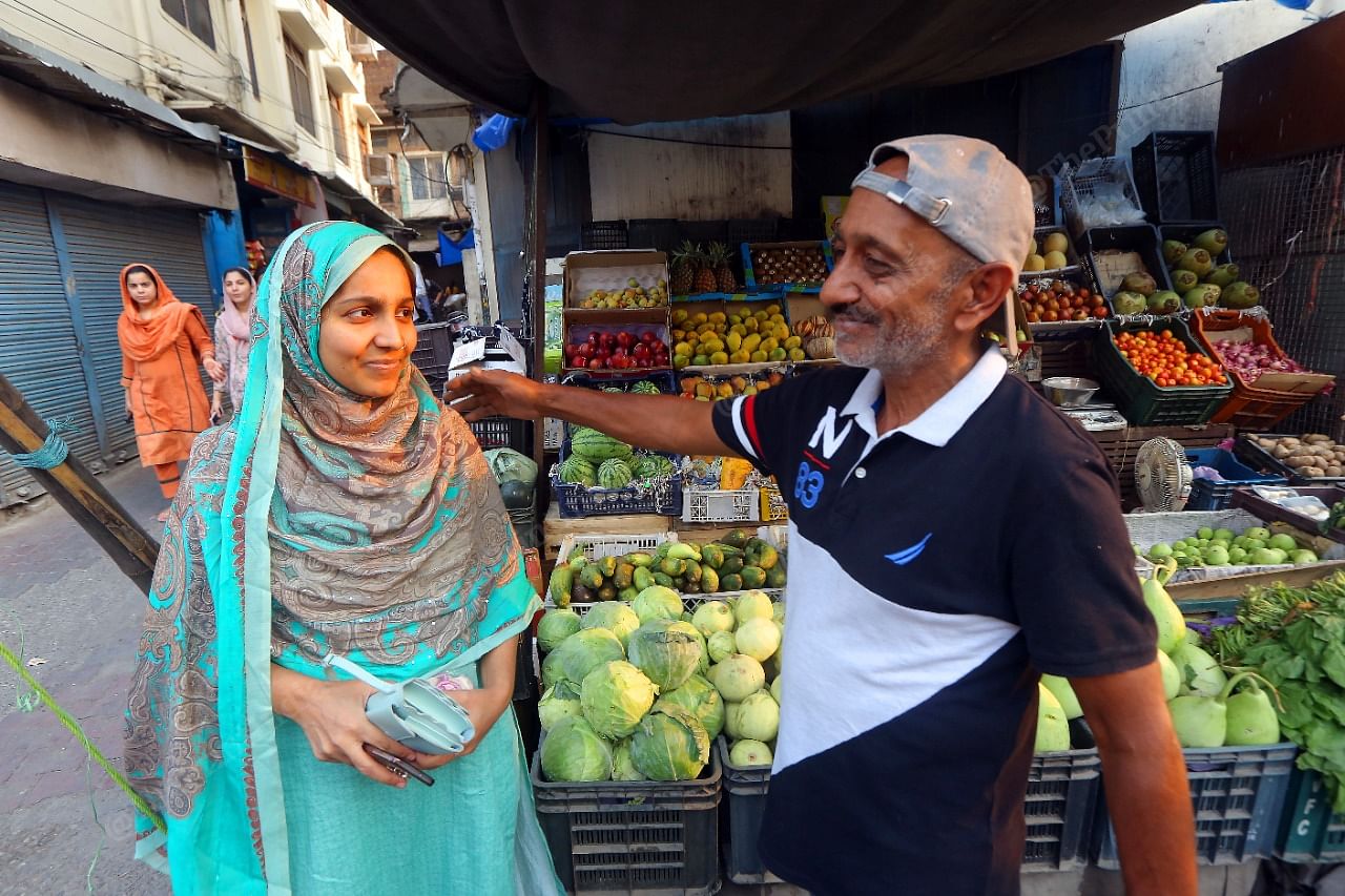 Umran's ister Shehnaz with father Abdul Rashid outside their shop in Jammu| Photo: Praveen Jain | ThePrint 