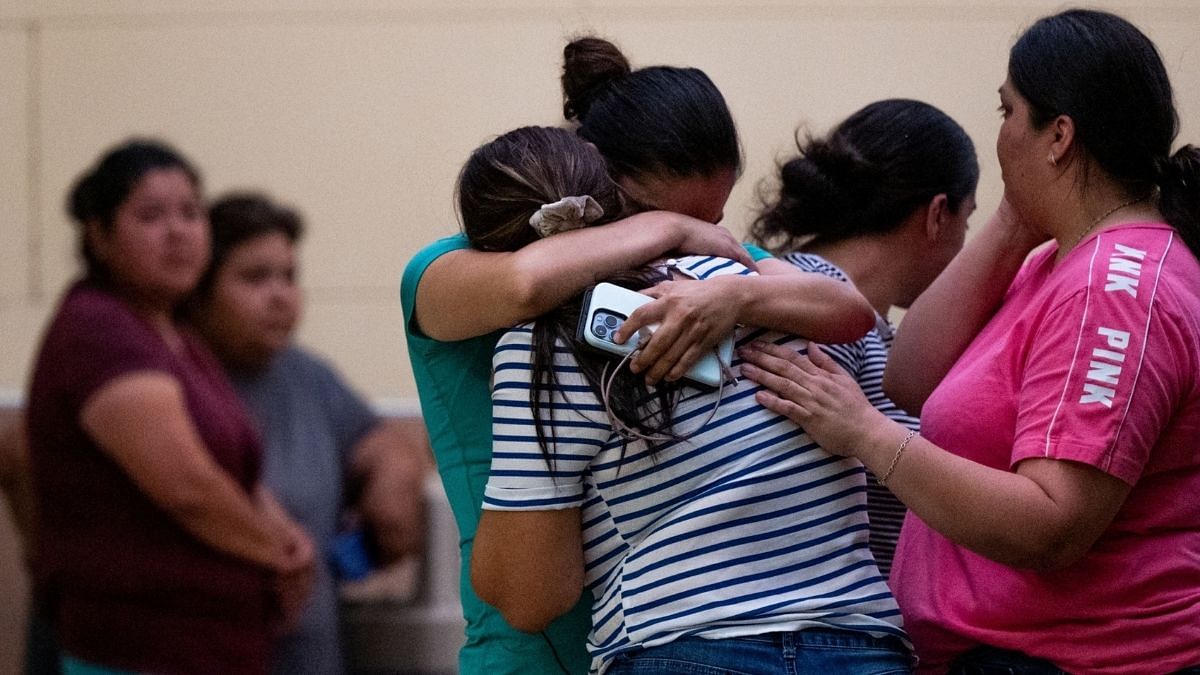 People mourn outside of the SSGT Willie de Leon Civic Center following the mass shooting at Robb Elementary School on 24 May 24 in Uvalde, Texas | Photo by Brandon Bell/Getty Images via Bloomberg