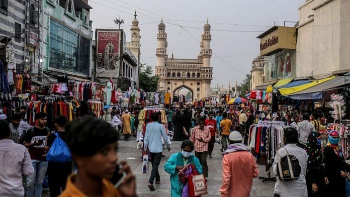 Shoppers walk through a market in the Charminar area in Hyderabad | Representational image | Bloomberg