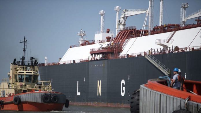 Tug boats prepare to pull out an LNG Tanker vessel at the Cheniere Sabine Pass Liquefaction facility in Cameron, US | Representational image | Bloomberg