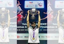 Srikanth Kidambi poses with the trophy after the Indian badminton team won the Thomas Cup 2022, in Bangkok Sunday