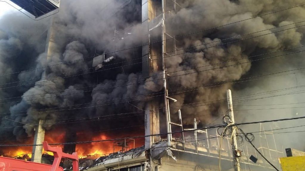 A view of the fire that broke out near West Delhi's Mundka Metro station on 13 May | Photo: Twitter
