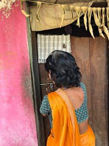 Mathura closes the door of her house | Jyoti Yadav