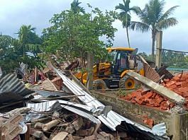 A bulldozer demolishes the house of a relative of a man who reportedly took part in burning Batadrava Police station | Photo: ANI