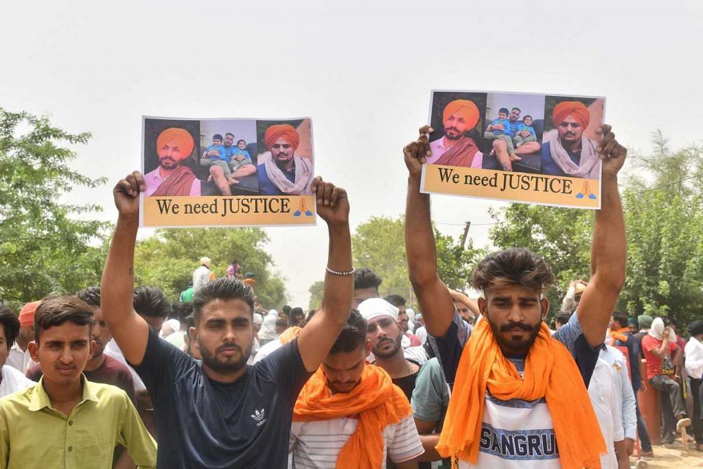 Fans bearing "We Need Justice" signs at Moose Wala's funeral | Suraj Singh Bisht | ThePrint