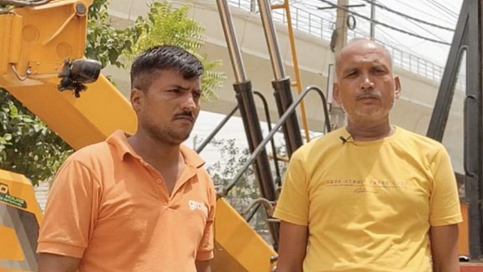 Crane operator Dayanand Tiwari (R) with his cousin Anil | ThePrint
