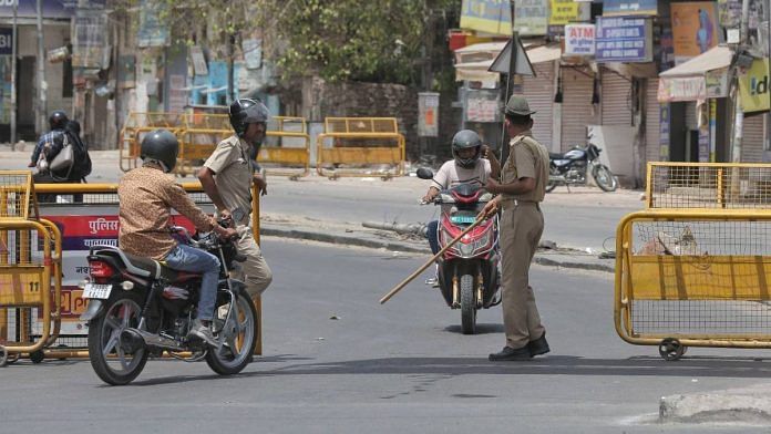 Police stop a bike for checking after clashes in Jodhpur | Suraj Singh Bisht | ThePrint