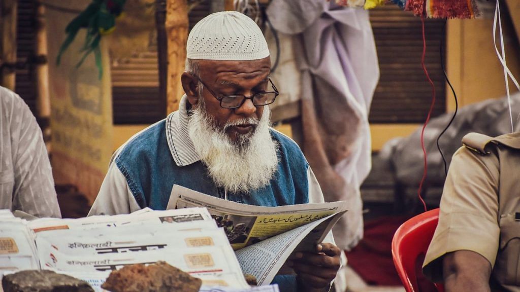 Representational image of man reading a newspaper | Syed Fahad/Unsplash
