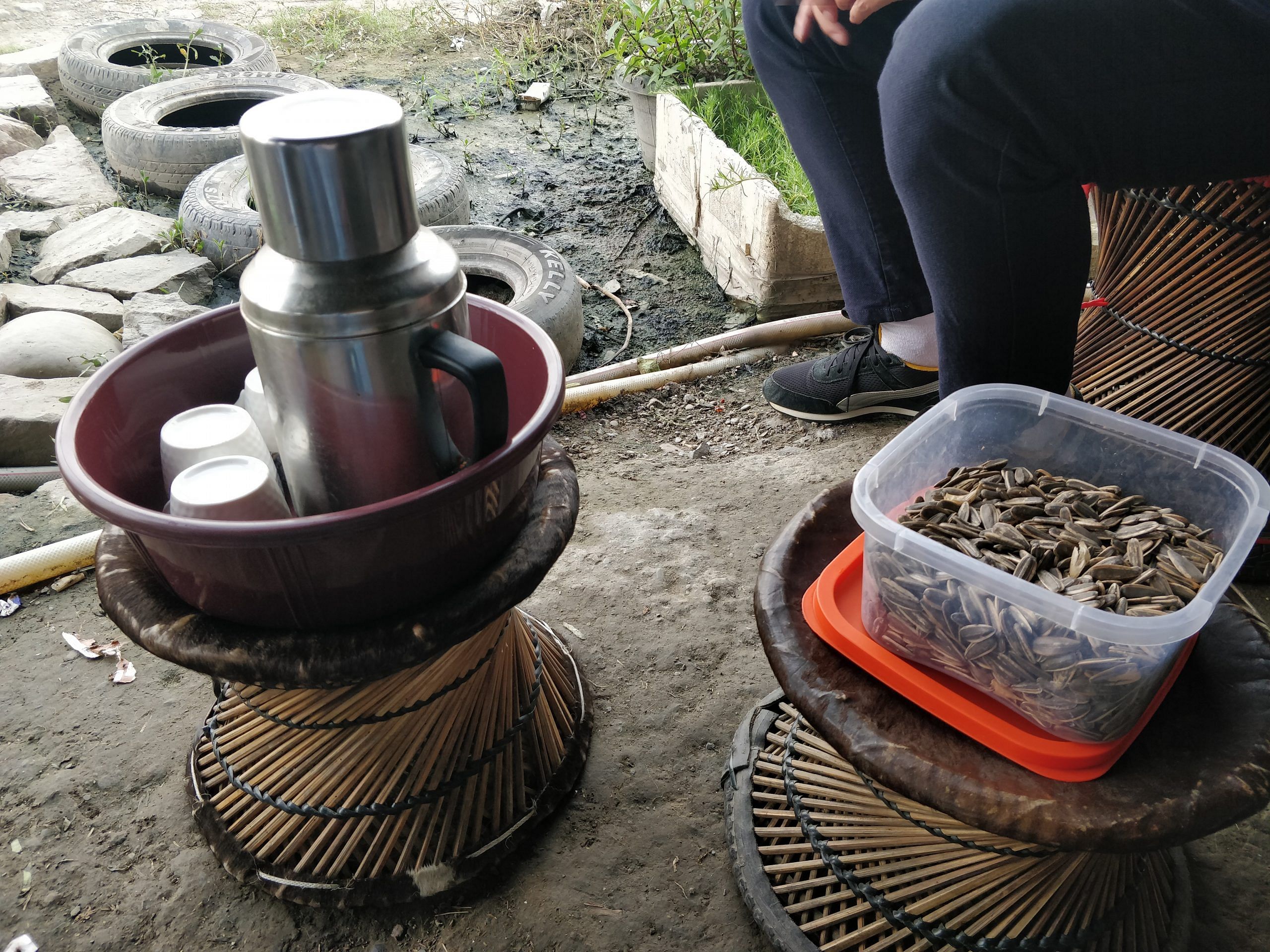Myanmarese customary tea and sunflower seeds are served at a home of a Myanmar refugee in Churachandpur. | Photo Credit: Sonal Matharu