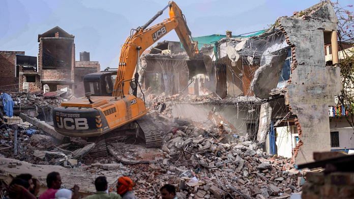 A bulldozer being used to demolish the residence of Javed Ahmed, Prayagraj, 12 June 2022 | PTI