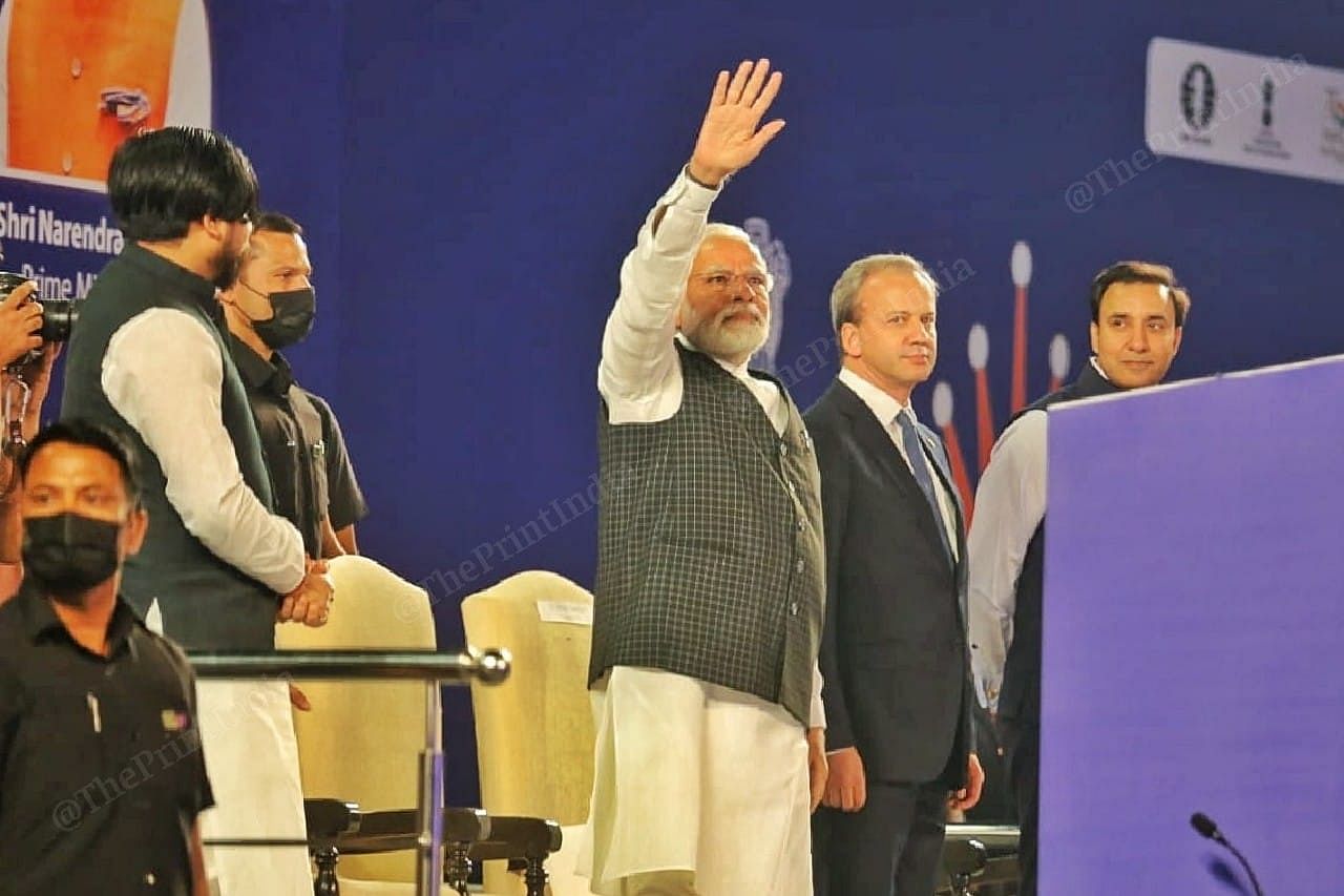 PM Modi cheers the crowd at the Indira Gandhi Stadium | Photo: Praveen Jain | ThePrint
