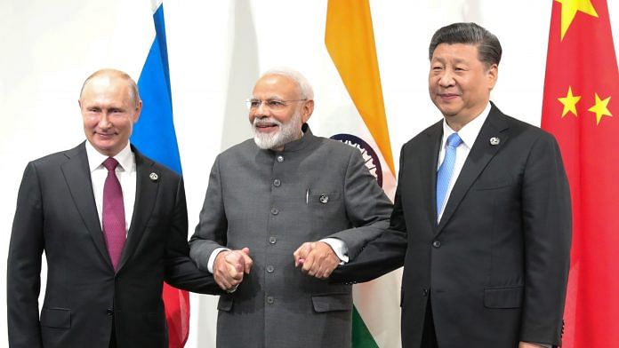 File photo of Russian President Vladimir Putin, Indian Prime Minister Narendra Modi and Chinese President Xi Jinping on the sidelines of the G20 summit in Osaka on 28 June 2019