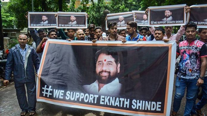 Supporters of rebel Shiv Sena leader Eknath Shinde outside his residence in Thane | PTI Photo