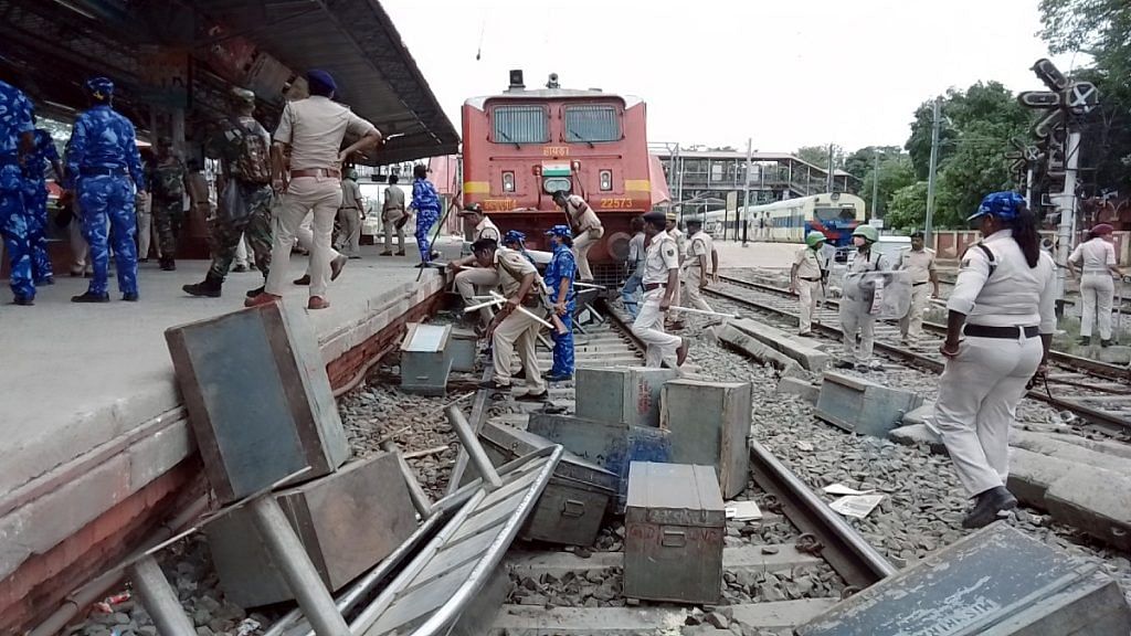 Paramilitary and police personnel at Patna's Danapur railway station, which was vandalised by youth protesting against the central government's Agnipath recruitment scheme for the armed forces Friday | ANI