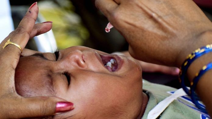 Healthcare worker administering polio drops to an infant as part of an anti-polio drive | ANI File Photo