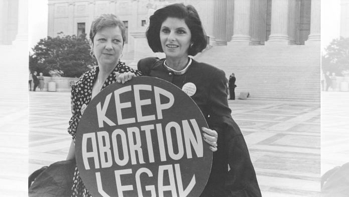 A scanned photo of Norma McCorvey, or Jane Roe (left), outside the Supreme Court in April 1989 with her attorney, Gloria Allred | Credit: Lorie Shaull via Wikimedia Commons