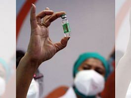 A vial of Covishield vaccine held up by a health worker | Representational image | ANI