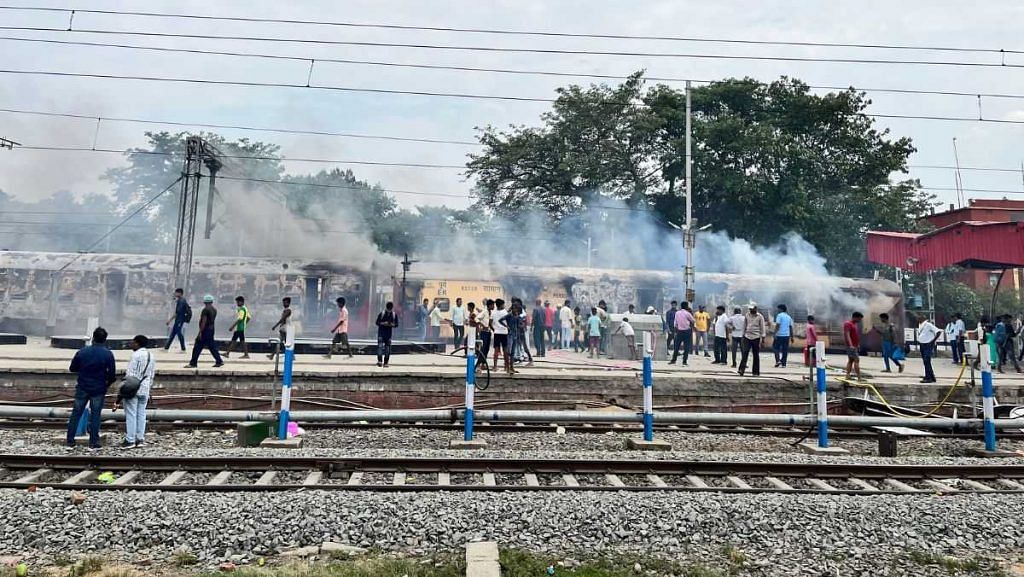 A train set on fire at Bihar’s Danapur Railway Station amid protests over the Centre’s Agnipath military recruitment scheme, 17 June, 2022 | Jyoti Yadav, ThePrint