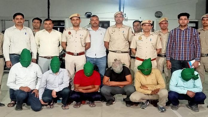 Delhi Police personnel with some of the accused | By special arrangement