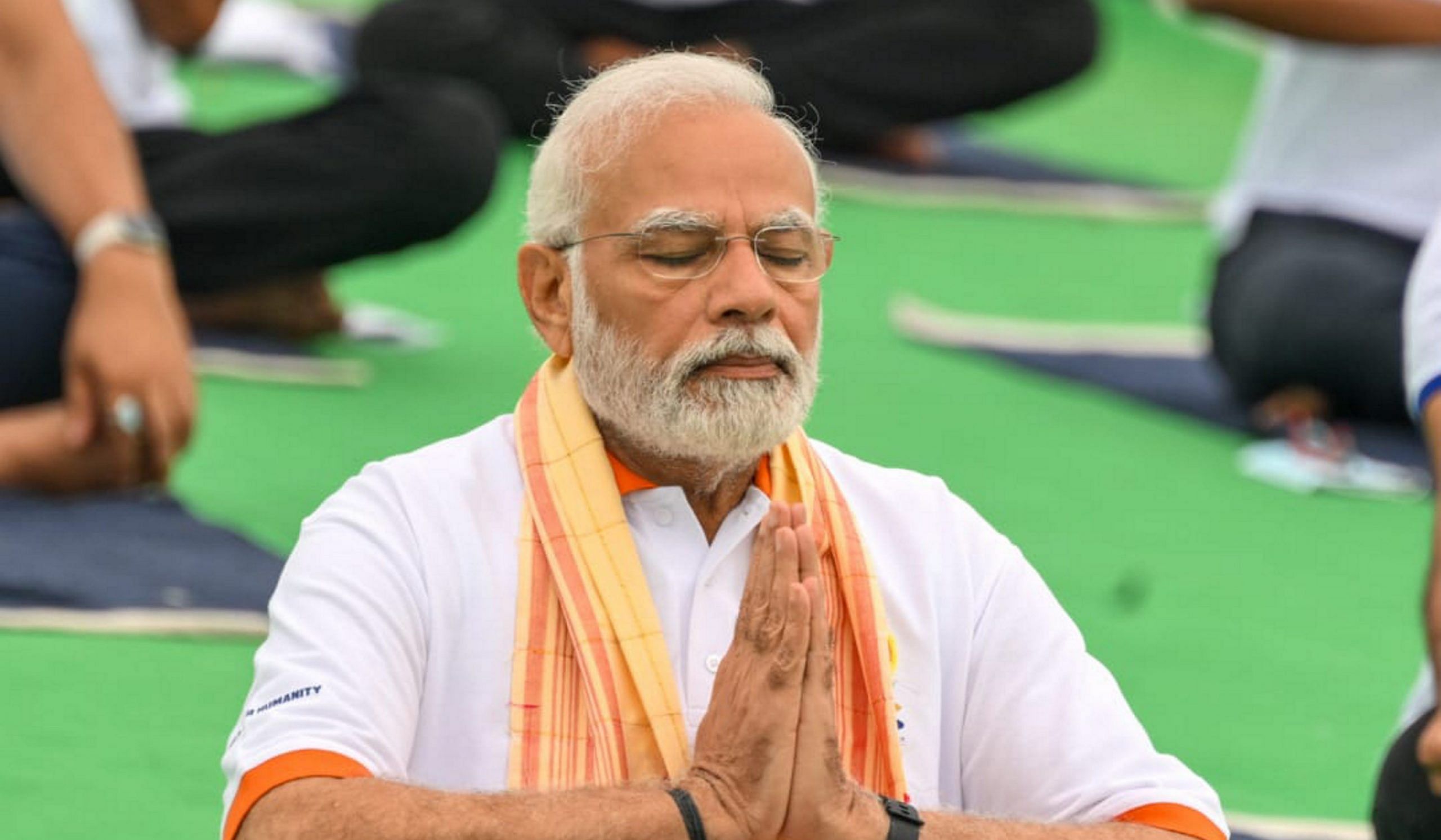 Prime Minister Narendra Modi performs yoga at the main event of the eighth edition of the International Day of Yoga at the Mysore Palace in Karnataka on 21 June 2022 | PTI Photo