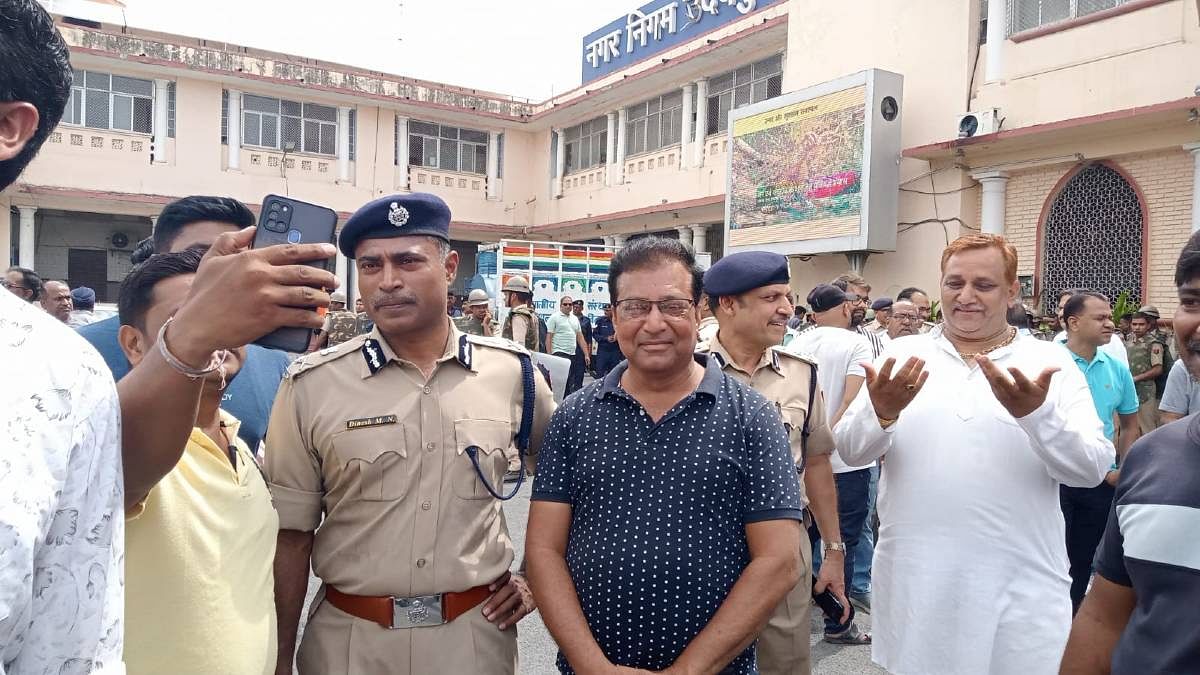 Protestors gather for selfies with senior cop Dinesh M.N. | Photo: By special arrangement