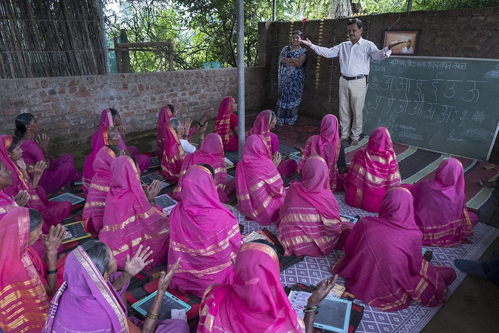 Yogendra Bangar, the founder of the school Aajibaichi Shala, interacts with the students on a regular basis to oversee their progress. Bangar lives in a village close to Phagane village | Jayati Saha