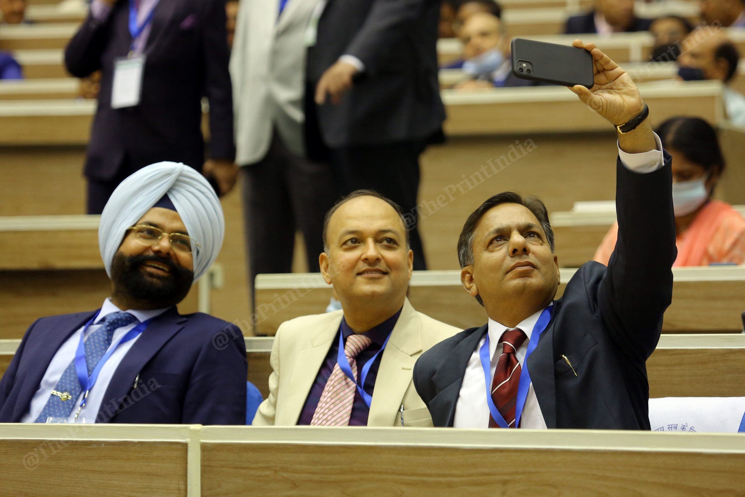 Judges taking selfies during the inaugural session of First All India District Legal Services Authorities Meet, at Vigyan Bhawan in New Delhi | Praveen Jain | ThePrint