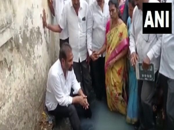 YSRCP MLA enters open drain as mark of protest against civic authorities 