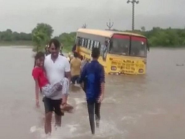 School bus stuck in water in Mahabubabad following heavy rain ...