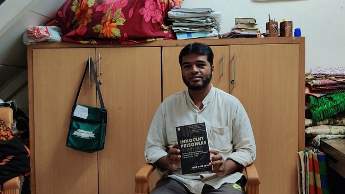 Abdul Wahid Din Mohammad Shaikh with his book 'The Innocent Prisoner'. | Photo Credit: Special Arrangement