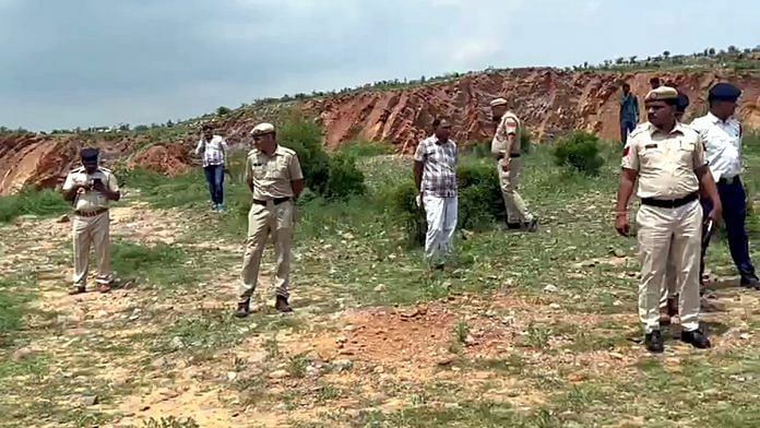 Police personnel inspect the site where DSP Surendra Singh was run over by a dumper driver, in Nuh Tuesday | ANI