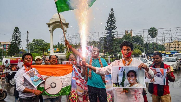 BJP workers celebrate in anticipation of Droupadi Murmus victor during counting of votes to elect the President in Patna, on 21 July 2022 | PTI
