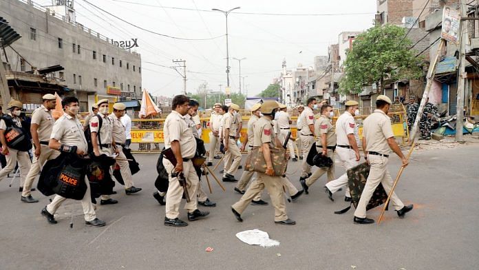 Police personnel patrol on the occasion of Eid-ul-Fitr festival at Jahangirpuri where violence erupted on April 16, in New Delhi on Tuesday. (ANI Photo/Amit Sharma)