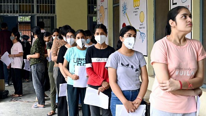 Candidates wait in a queue to appear for the National Eligibility and Entrance Test (NEET) UG 2022 in Mandi, on 17 July 2022 | Representational image | ANI photo