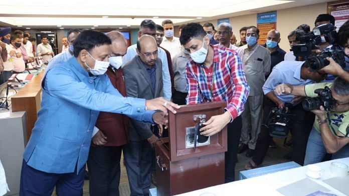 Chief Election Commissioner Rajiv Kumar gives a demo to officers before they leave with the ballot boxes on 12 July | Photo: ECI
