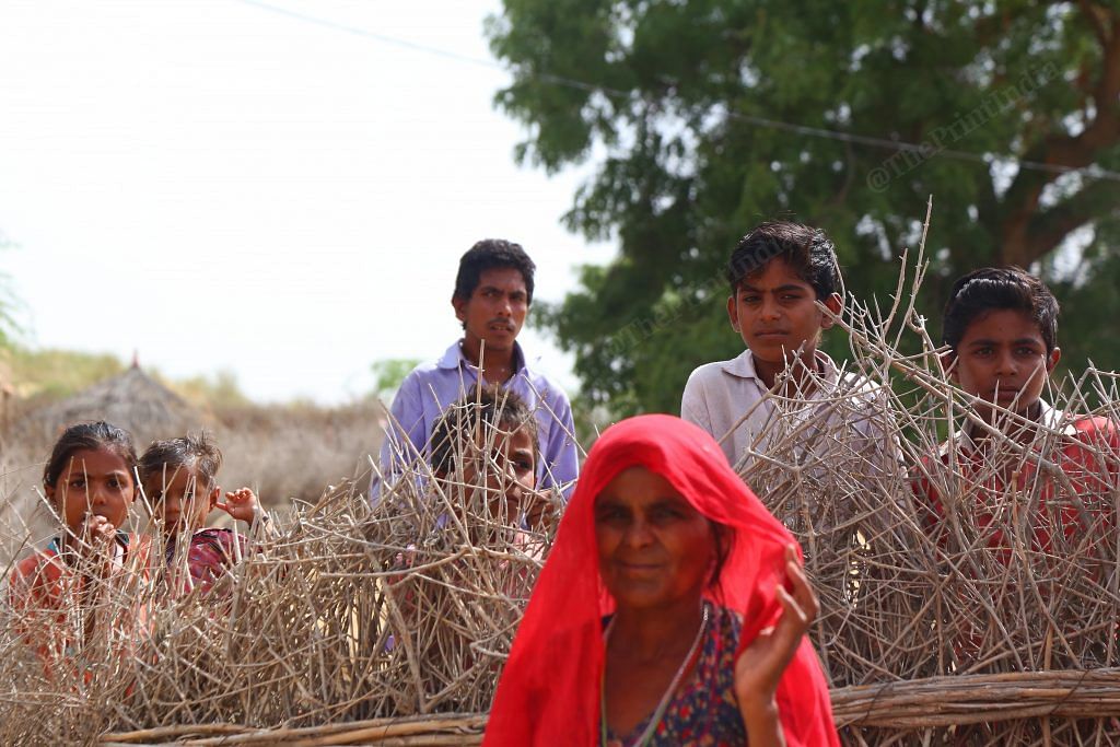 Villagers and family members gather around Amku Meghwal | Manisha Mondal/ThePrint