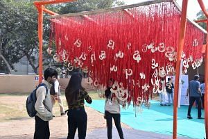 Attendees posing with the decorations at a lit festival in Ahmedabad. From Facebook reels to Insta 'glamshots'—literary events are also becoming a space GenZs are boasting about on their social media. | Photo Credit: Gujarat Literary Festival