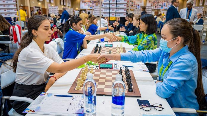 Koneru Humpy shakes hands with Nana Dzagnidze as India A defeated third-seeded Georgia 3-1 in the sixth-round match of the women’s section at the 44th Chess Olympiad in Mamallapuram | PTI