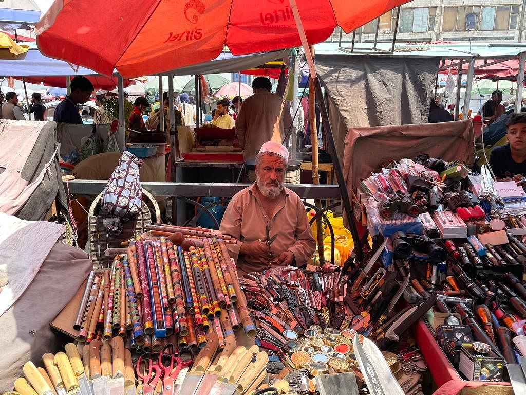 A shopkeeper sits among his wares | Jyoti Malhotra | ThePrint