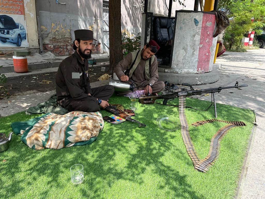 Two young Talib sitting at a checkpoint at Sherpur | Jyoti Malhotra | ThePrint