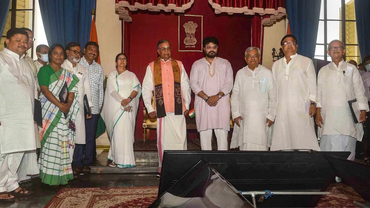 The new ministers with West Bengal Governor La Ganesan and Chief Minister Mamata Banerjee at Raj Bhavan Wednesday in Kolkata | PTI The new ministers with West Bengal Governor La Ganesan and Chief Minister Mamata Banerjee at Raj Bhavan Wednesday in Kolkata | PTI