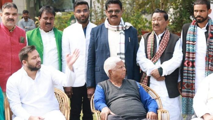 File photo of Bihar law minister Kartik Singh (centre) with RJD leaders Lalu Prasad and Tejashwi Yadav | Facebook | @Kaushal Yadav